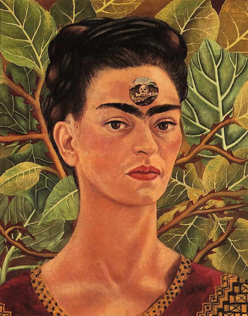Self-portrait by Frida Kahlo titled 'Thinking About Death,' showing her intense gaze with a skull set against lush green foliage, reflecting her contemplation of life's impermanence.