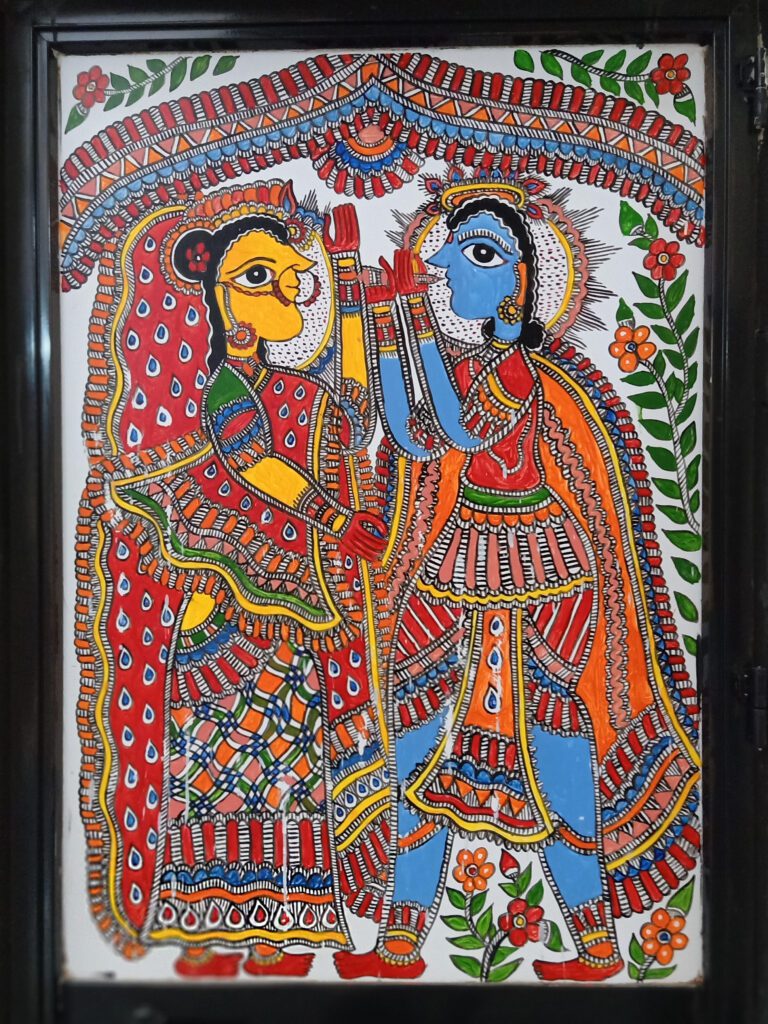 Madhubani painting depicting the divine couple Lord Ram and Sita in vibrant traditional attire, symbolizing the Ram-Sita Vivah, a central story in the Madhubani art narrative.