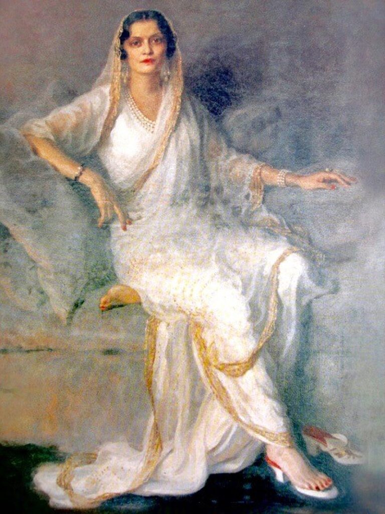 Philip Alexius de László's painting of Maharani Indira Devi, showcasing her in a radiant white saree with gold accents, reflecting the noble poise and cultural elegance of Indian royalty.