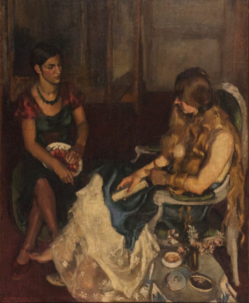 Amrita Sher-Gil's painting 'Two Girls' depicting a seated young woman in a red dress looking contemplatively to the side and another with long hair and a white dress engaged in sewing, showcasing Sher-Gil's mastery of capturing human emotion and interaction with rich, muted tones.