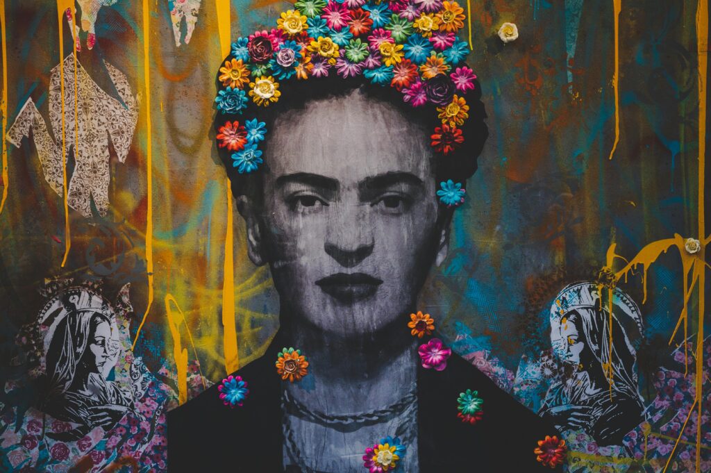 Graffiti of Frida Kahlo with a vibrant crown of flowers symbolizing the resilience and creativity of artists overcoming art block.